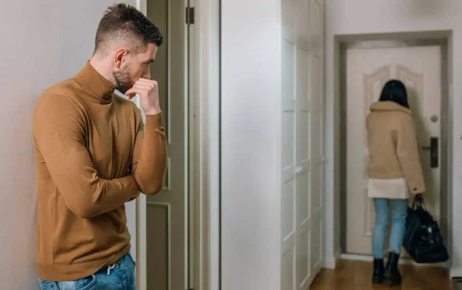 Woman walks out door after break up