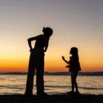 Silhouette of mother and child