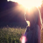 woman with sun glowing from heart