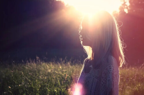 woman with sun glowing from heart