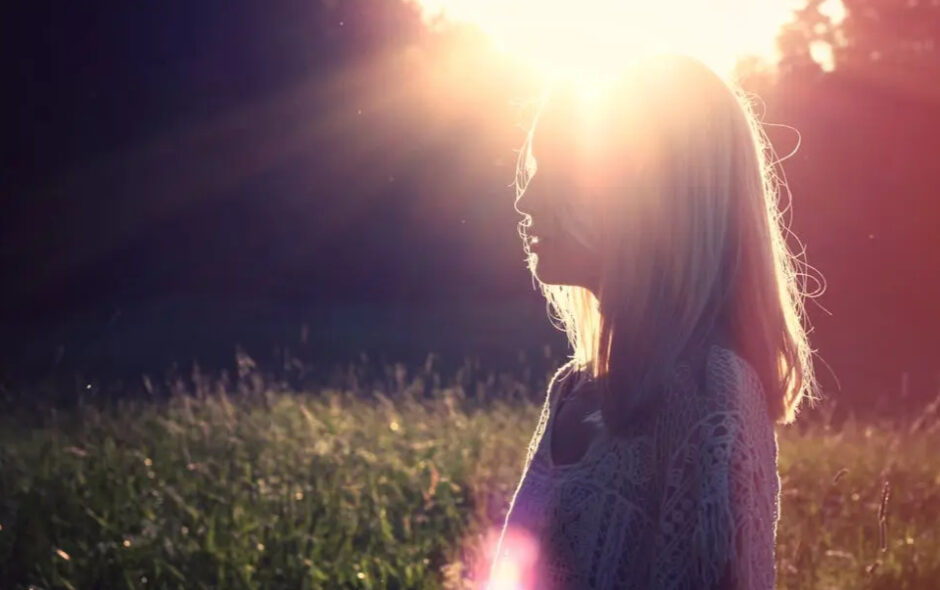 woman with sun glowing from heart