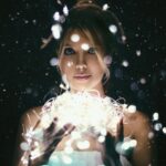 woman holding ball of light