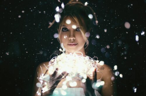 woman holding ball of light