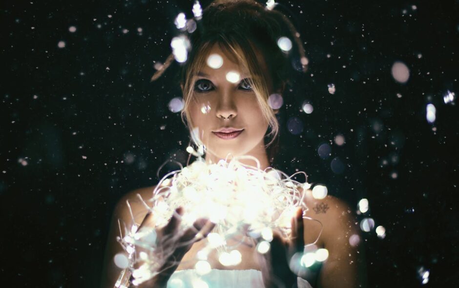 woman holding ball of light